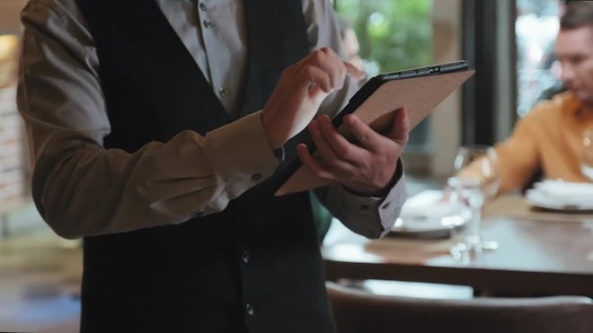https://motionarray.imgix.net/anonymous-male-waiter-with-tablet-taking-order-for-dinner-in-restaurant-2287184-high_0005.jpg?auto=format&fit=max&q=60&w=660