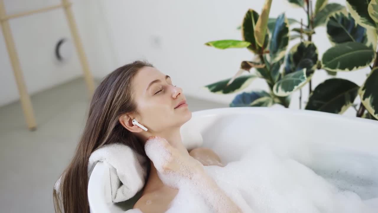 Bath Music With Airpods. Stock Video Motion Array