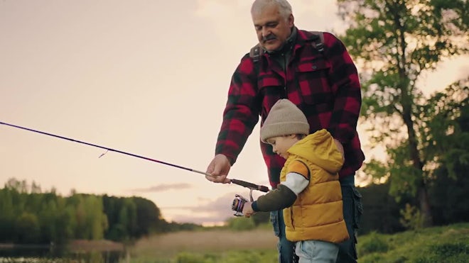 Boy Fishes, Grandpa Helps, Family Rests. - Stock Video