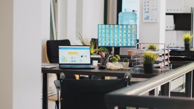 Company Workspace With Nobody In And Business Figures On Computer Monitors - Stock Video | Motion Array