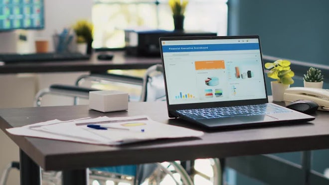 Company Workspace With Nobody In And Business Figures On Computer Monitors - Stock Video | Motion Array
