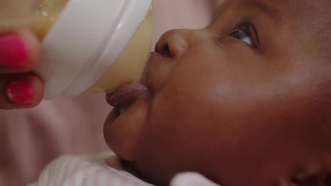 Cute Newborn Baby Sucking From Bottle - Stock Video | Motion Array