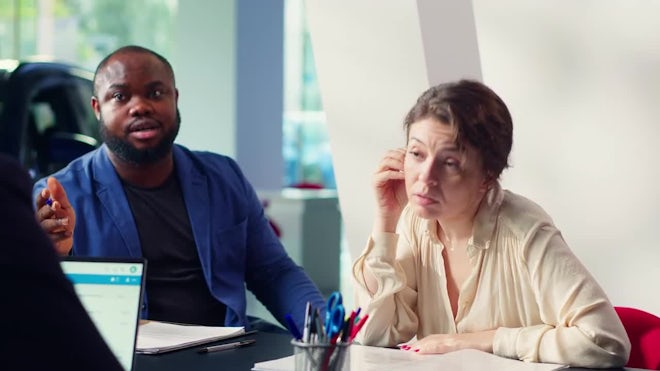 Dealership Clients Reading Contract Terms And Conditions - Stock