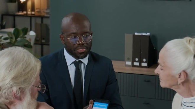 Elderly couple learning online banking apps