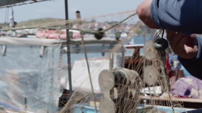 Fisherman Repairs Fishnets Fishing Lines - Stock Video