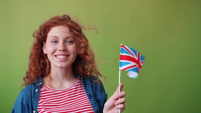 Young Woman With British Flag - Stock Video | Motion Array