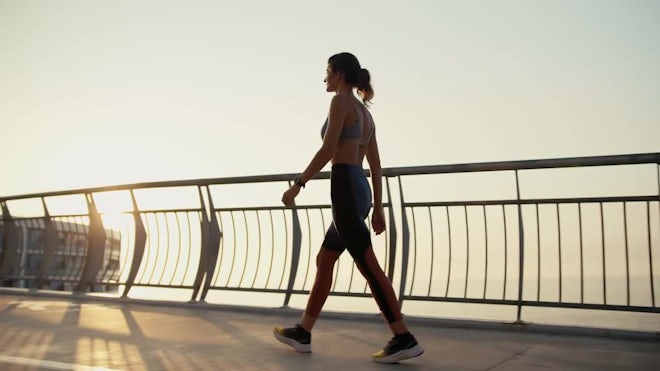 Woman Jogs On Bridge - Stock Video