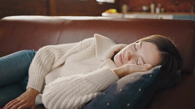 Young Mom Sleeping On Sofa. Preteen Daughter Coming Up To Her, Covering Mother - Stock Video | Motion Array