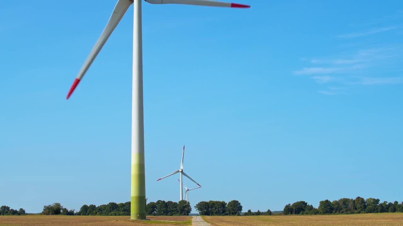 Wind Turbines In Farmer's Field - Stock Video | Motion Array