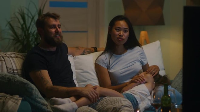 Diverse Parents With Sleeping Daughter - Stock Video | Motion Array