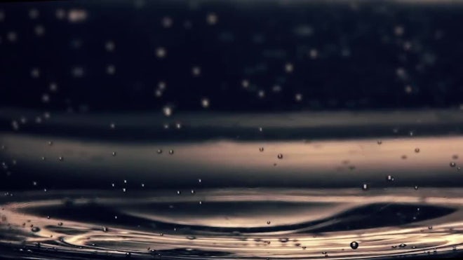 Circle shaped wine drops falling into glass closeup. Stock Photo by  stockbusters