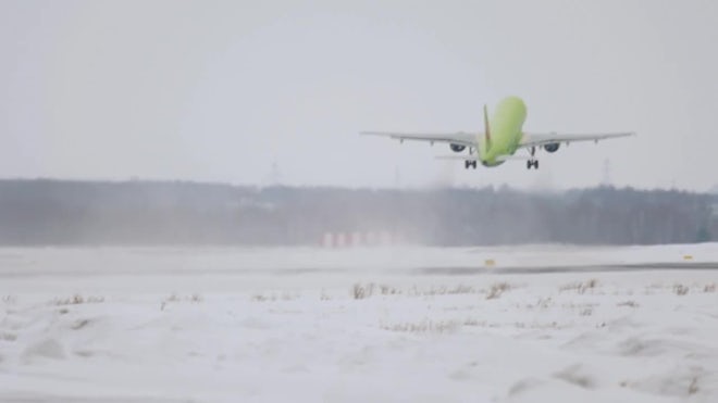 Plane Taking Off In Winter - Stock Video
