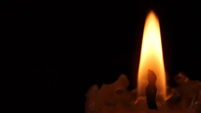 Candle Burns On A Black Background - Stock Video | Motion Array