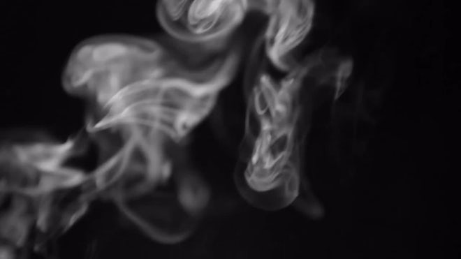 Smoke Swirling On Black Background