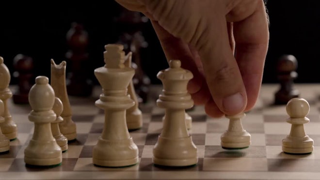 Super Slow Motion Chess Pieces Fall on the Chessboard. Filmed on a