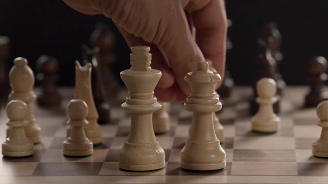 Super Slow Motion Chess Pieces Fall on the Chessboard. Filmed on a