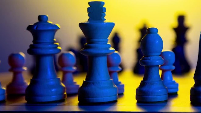 Close-up of chess game and chess pieces on table 4k from Pikwizard