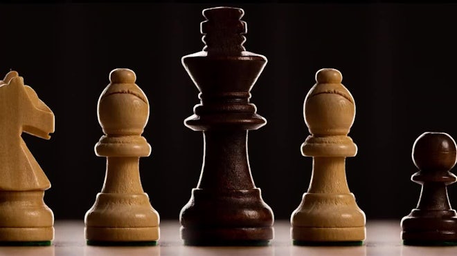 Close-up of chess game and chess pieces on table 4k from Pikwizard