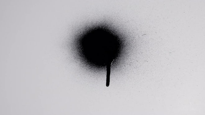 Black Spray Paint On White Background - Stock Video