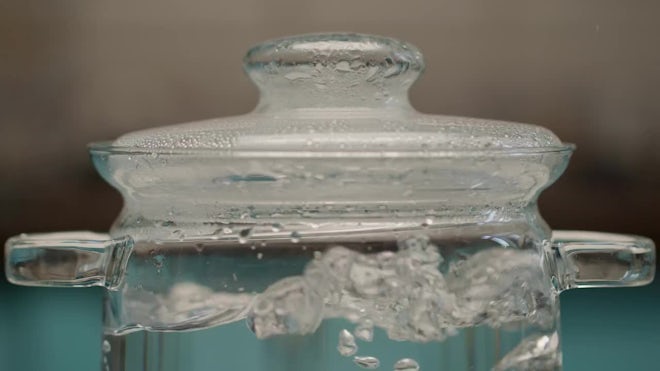 Close Up Boiling Water Bubbling Over In Lidded Glass Pot On Electric Stove  High-Res Stock Video Footage - Getty Images