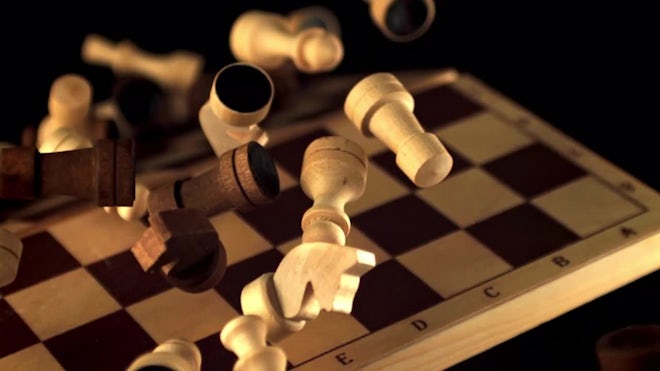 Chess Queen Beats King Between Other Pieces On The Chessboard