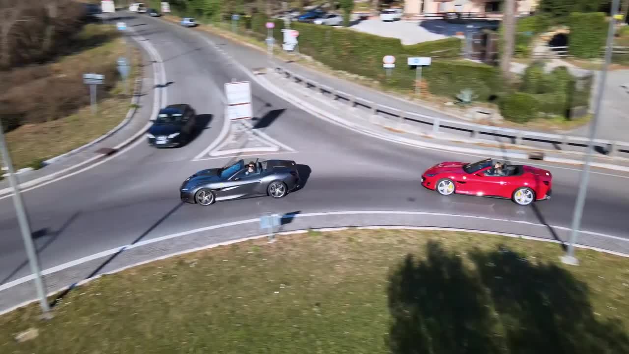 Sport Cars Drive Around A Roundabout Stock Video Motion Array