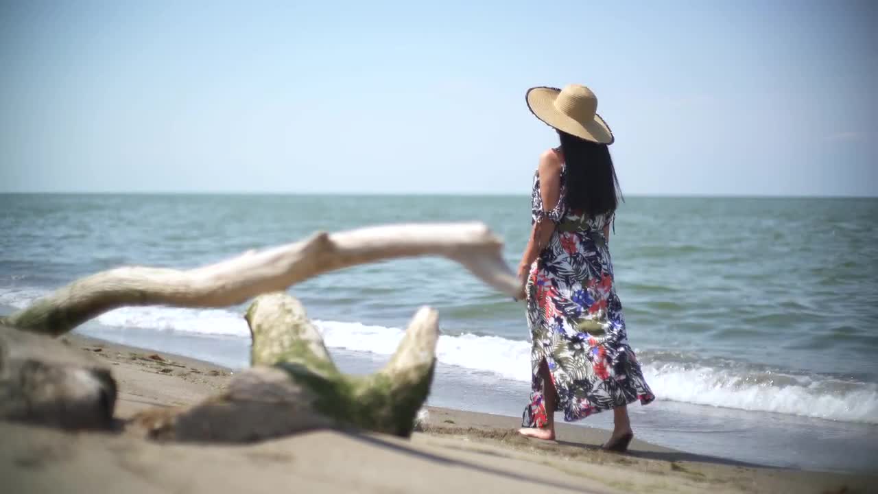 Alone girl walking on hot sale beach