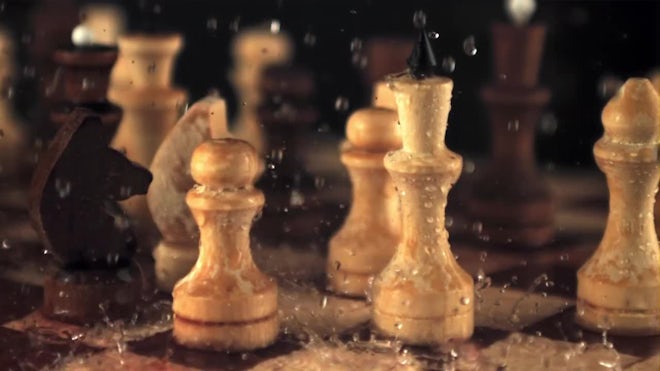 Black chess piece falling over, Stock Video