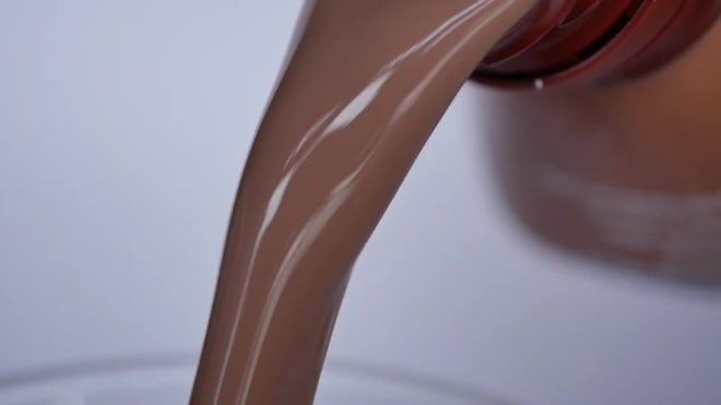 Chocolate milk poured into a glass