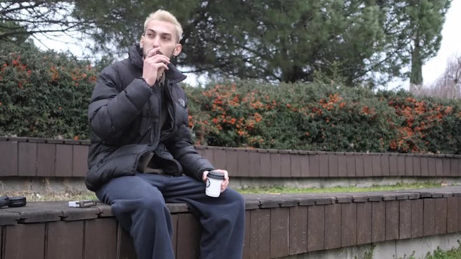 Man Smoking Cigarette In A Park - Stock Video