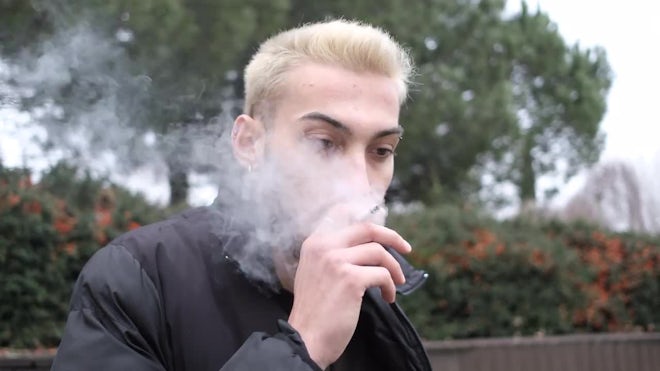 Man Smoking Cigarette In A Park - Stock Video