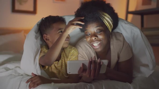 Mom And Son Using Tablet In Bedroom - Stock Video | Motion Array