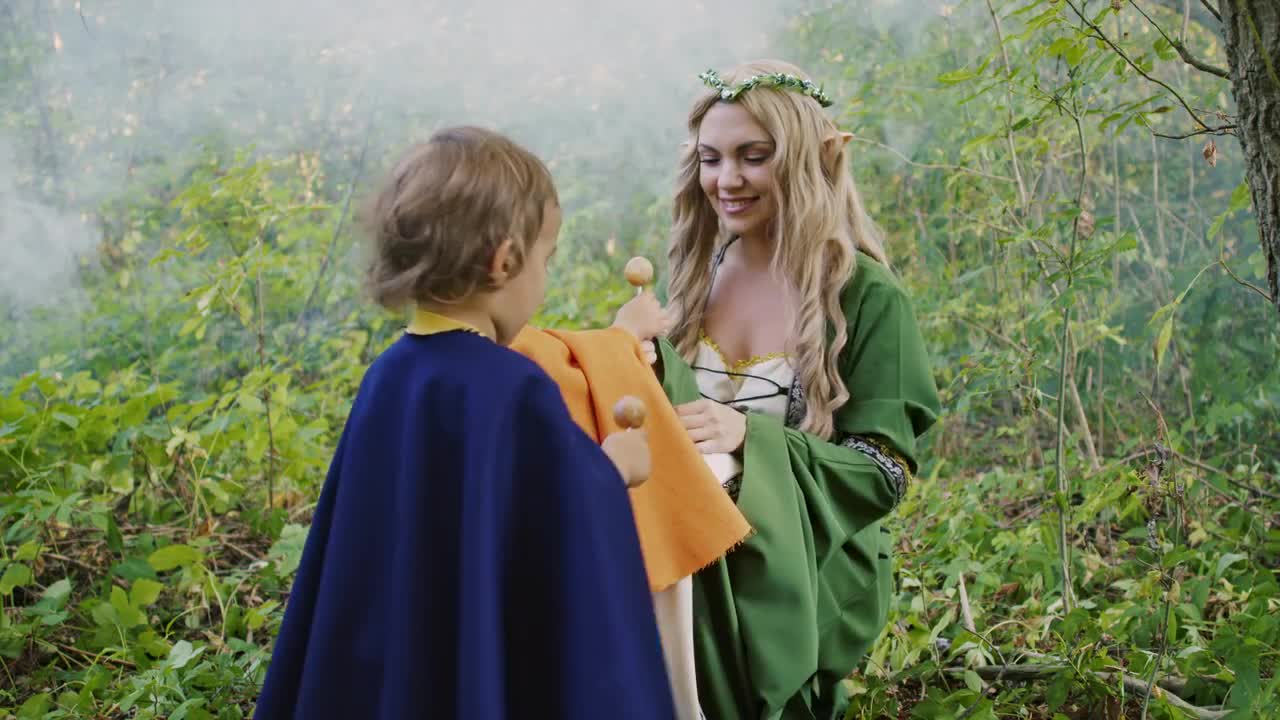 Fairy Elf Cosplay Woman Treats Babies Stock Video Motion Array