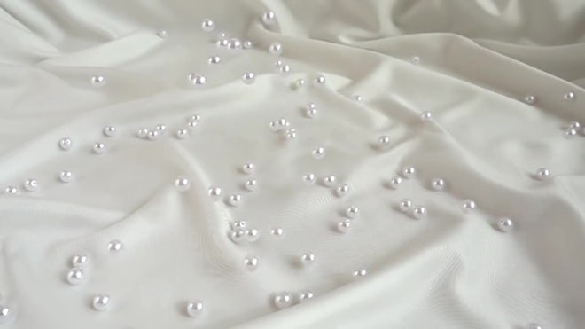 Pearls Fall On Silk. Slow Motion - Stock Video