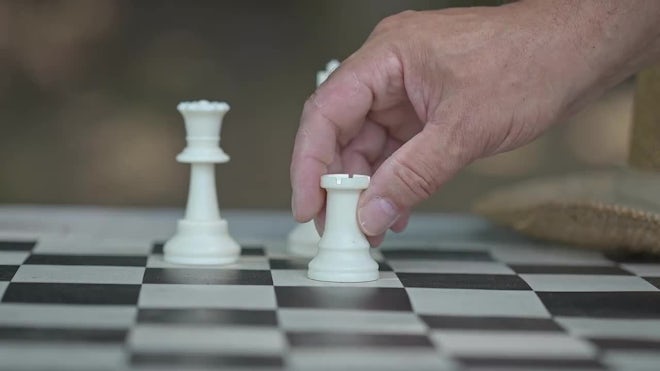 Man thinking about next chess move gets checkmate - Free Stock Video