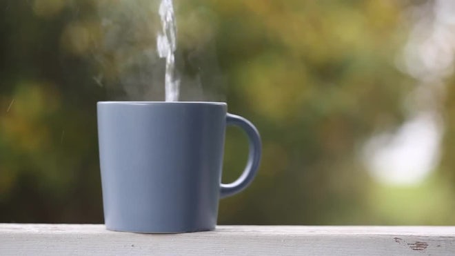 Pouring hot boiling water into cup or mu, Stock Video