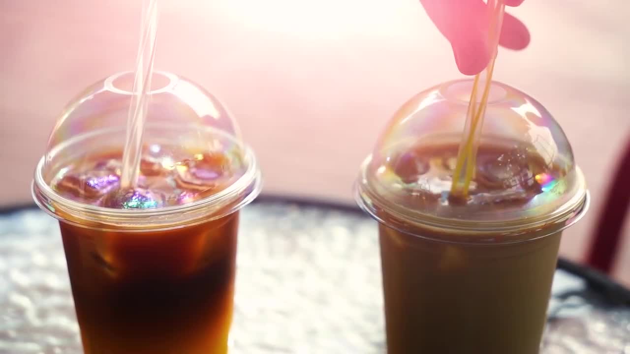 Two Cold Coffee Drinks With Ice. Terrace - Stock Video | Motion Array