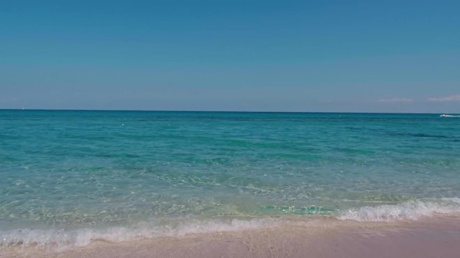 Crystal clear water of the tropical sea and white sand beach