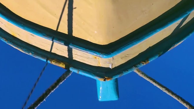 Reflection Of Wooden Fishing Boat And Mooring Rope In Blue Ocean Water - Stock  Video
