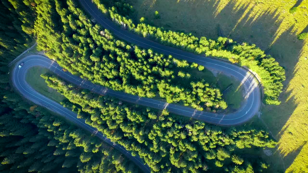 Aerial View Of Cars Driving Along Scenic Curvy Serpentine