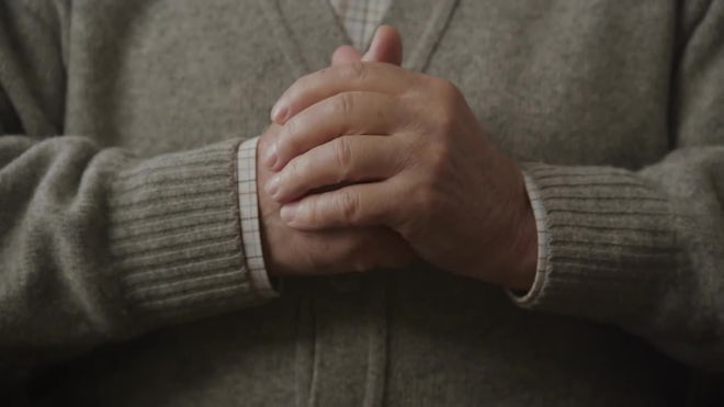 Male praying with hands clasped, Stock Video