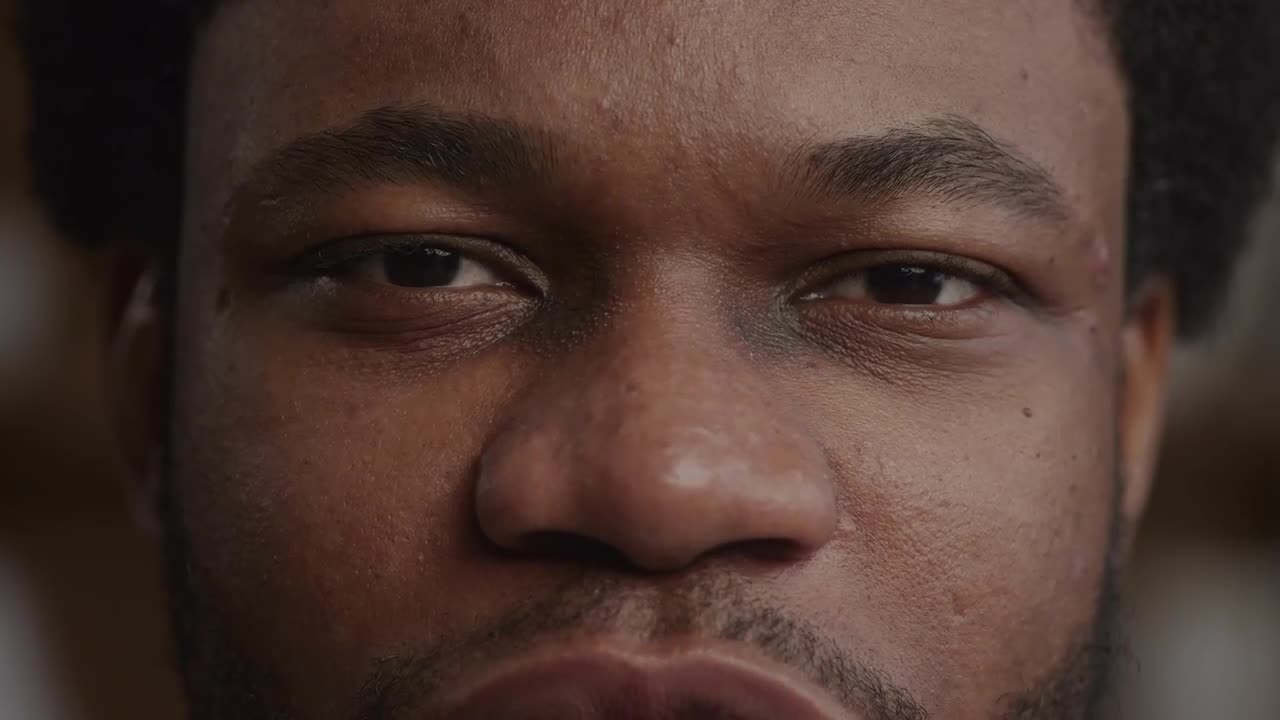 Extreme Close Up Of A Man Eyes Looking At Camera While Talking