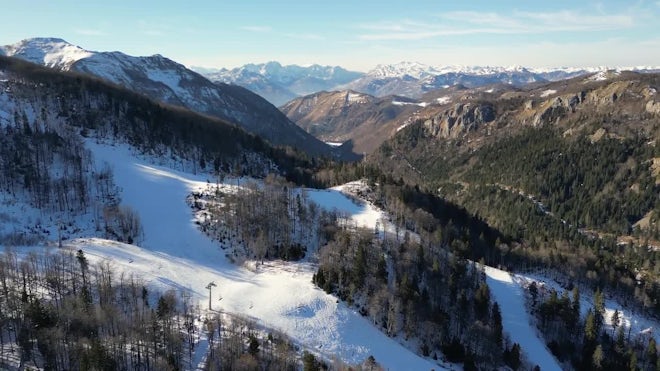 Aerial View Of Frozen Snowy Winter Forest At Golden Sunrise