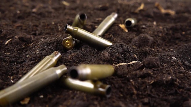 shell casings falling slow motion, Stock Video