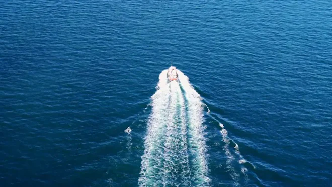Aerial View Of Three Fast Boats On A Deep Blue Sea With White Waves by vlad_star - Stock Video | Motion Array