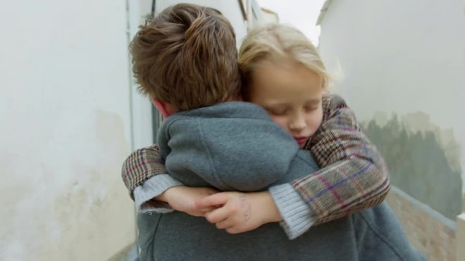 Brother Carrying Sleeping Sister - Stock Video | Motion Array