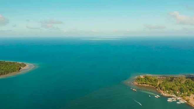 Sland Balabac Covered With Green Forest Against The Blue Sky With Clouds - Stock Video | Motion Array
