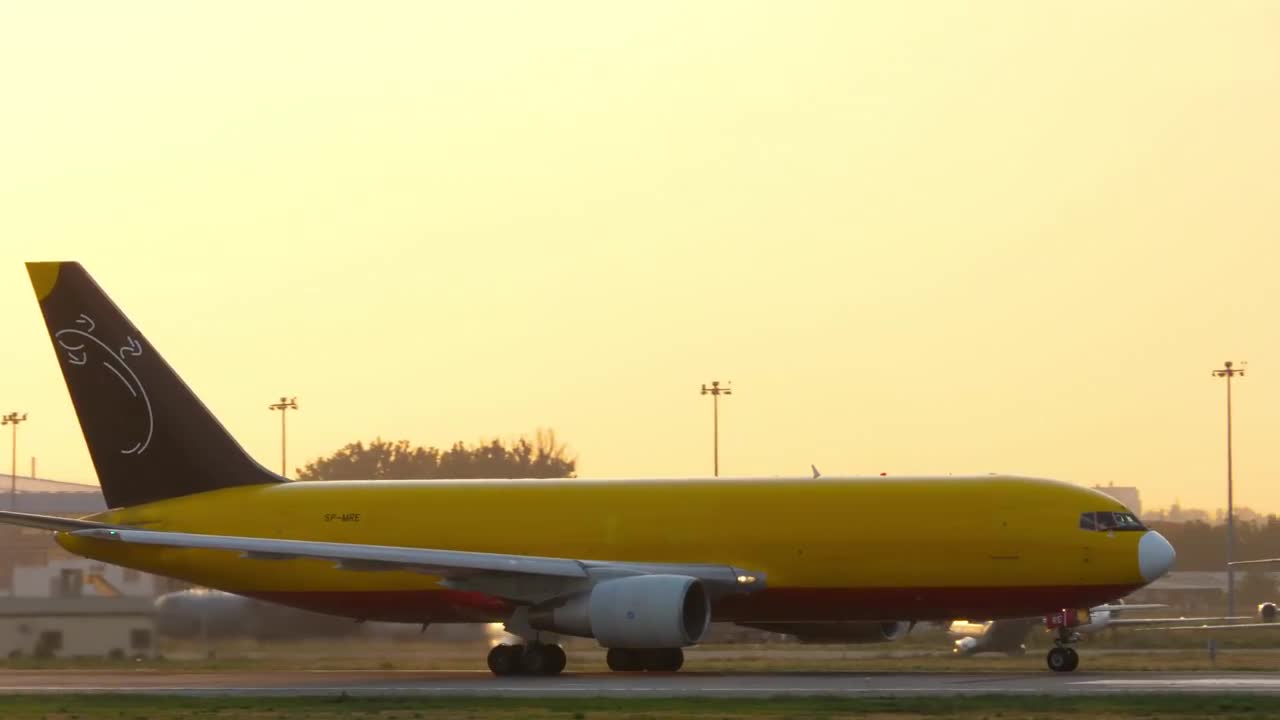 Cargo Yellow Plane On The Runway. Aircraft Boeing 767, SP