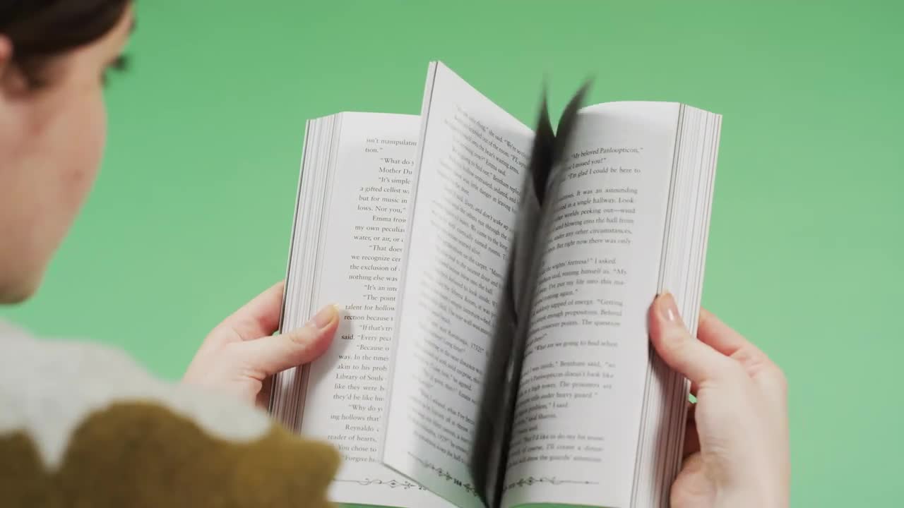 Woman Browsing Through A Book Stock Video Motion Array