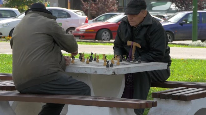 Two zoomers play the old game of chess 